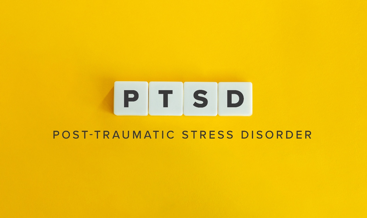 Image of PTSD spelled out on letter in front of a yellow background. We provide ptsd treatment in palm beach, FL. As well as complex ptsd treatment. Call today to talk to a ptsd therapist in Palm Beach, FL.