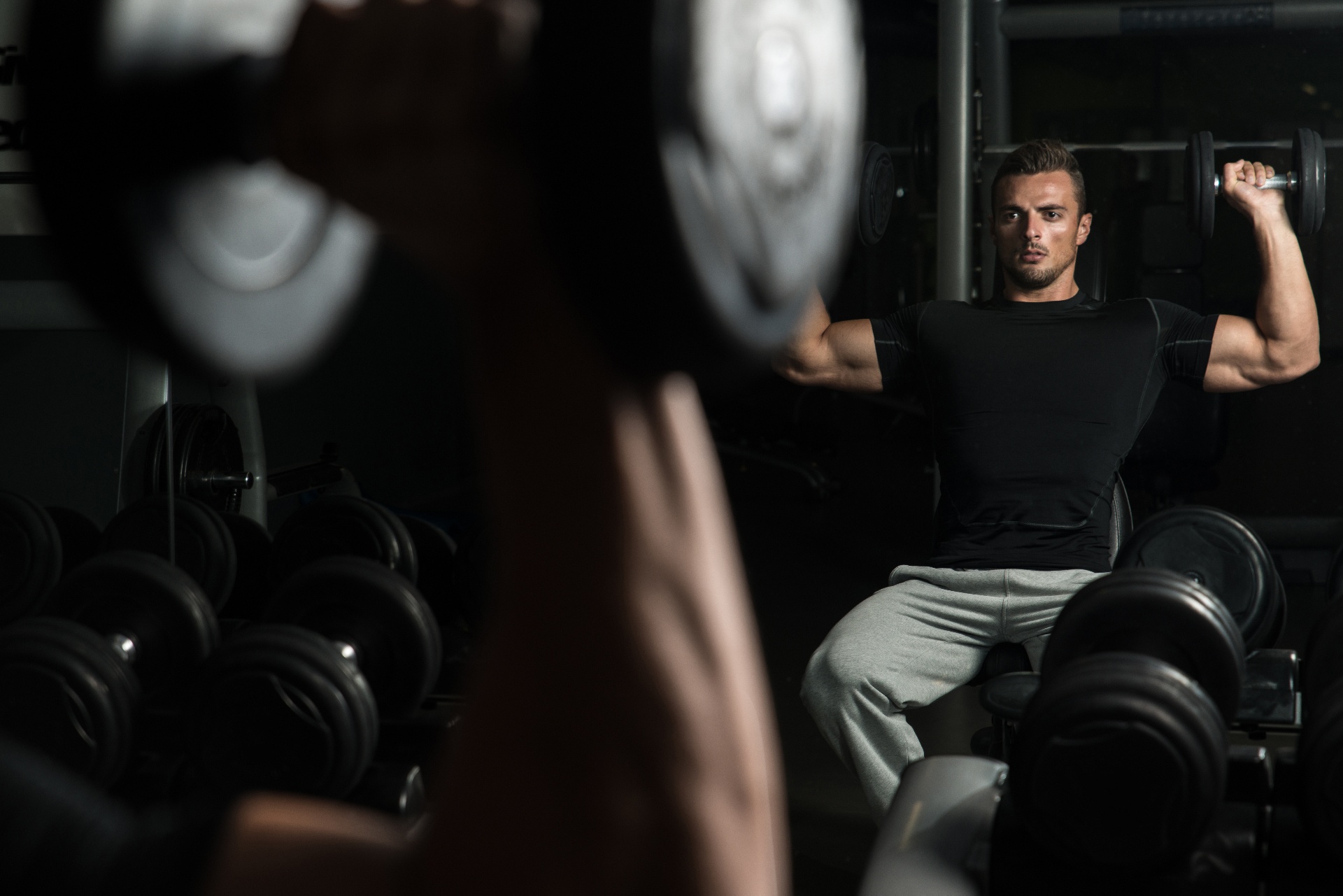 A man looks at himself in a mirror while lifting weights. A body image counselor in Delray Beach, FL can offer support with body dysmorphia treatment in Delray Beach, FL and other services. Search counseling for body image issues in Palm Beach County, FL to learn more.