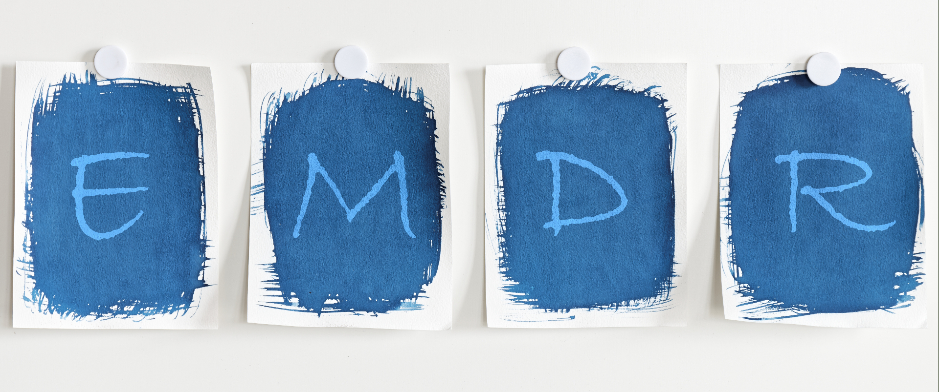 Four papers with letters spell out EMDR on a wall. Learn about EMDR therapy in Palm Beach, FL by searching "emdr near me" or contacting an addiction therapist in Palm Beach, FL today. We offer EMDR in Palm Beach, FL and more!