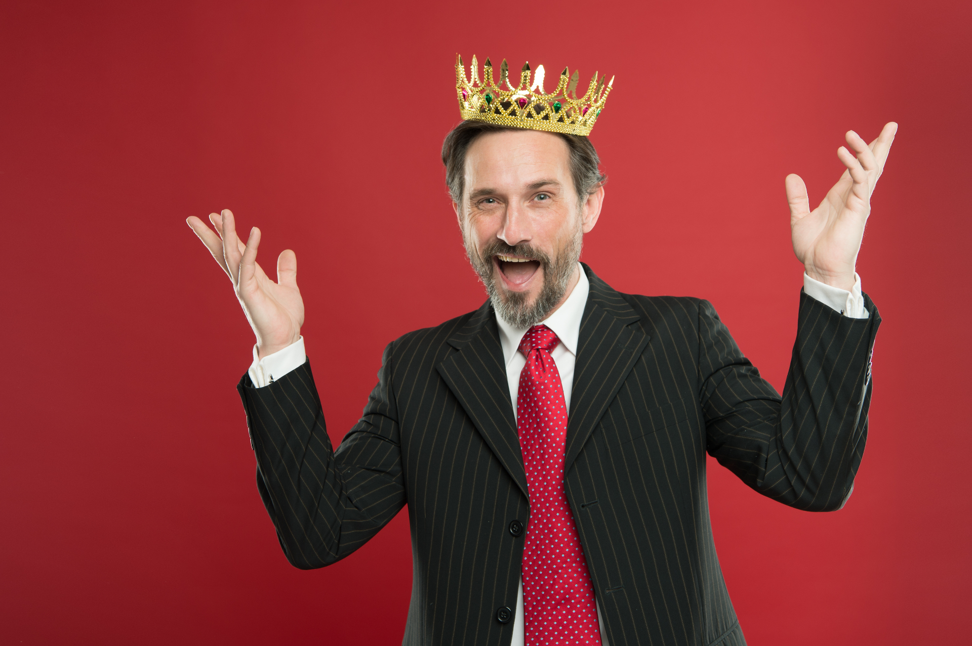 A man in a suit wears a crown with a smug expression. This could represent the ego a narcissism therapist in Palm Beach, FL can help keep in check. Learn more about online therapy in Florida by searching “treatment for narcissism in Palm Beach, FL” today.