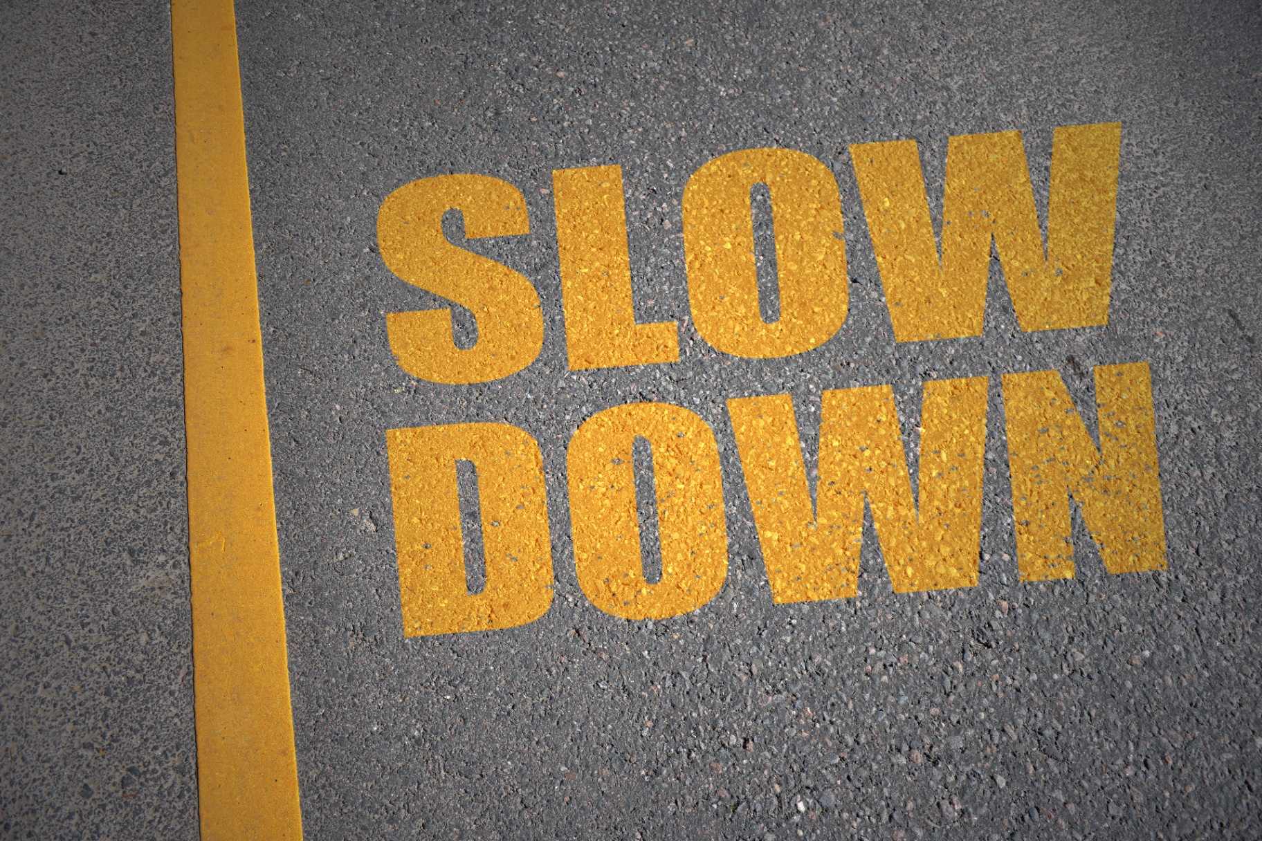 A close-up of the words “slow down” on the pavement. Learn how a trauma therapist in Miami, FL can support you in your recovery journey. Trauma therapy in Delray Beach, FL can offer in-person and online support, so search “trauma therapy delray beach” today. 
