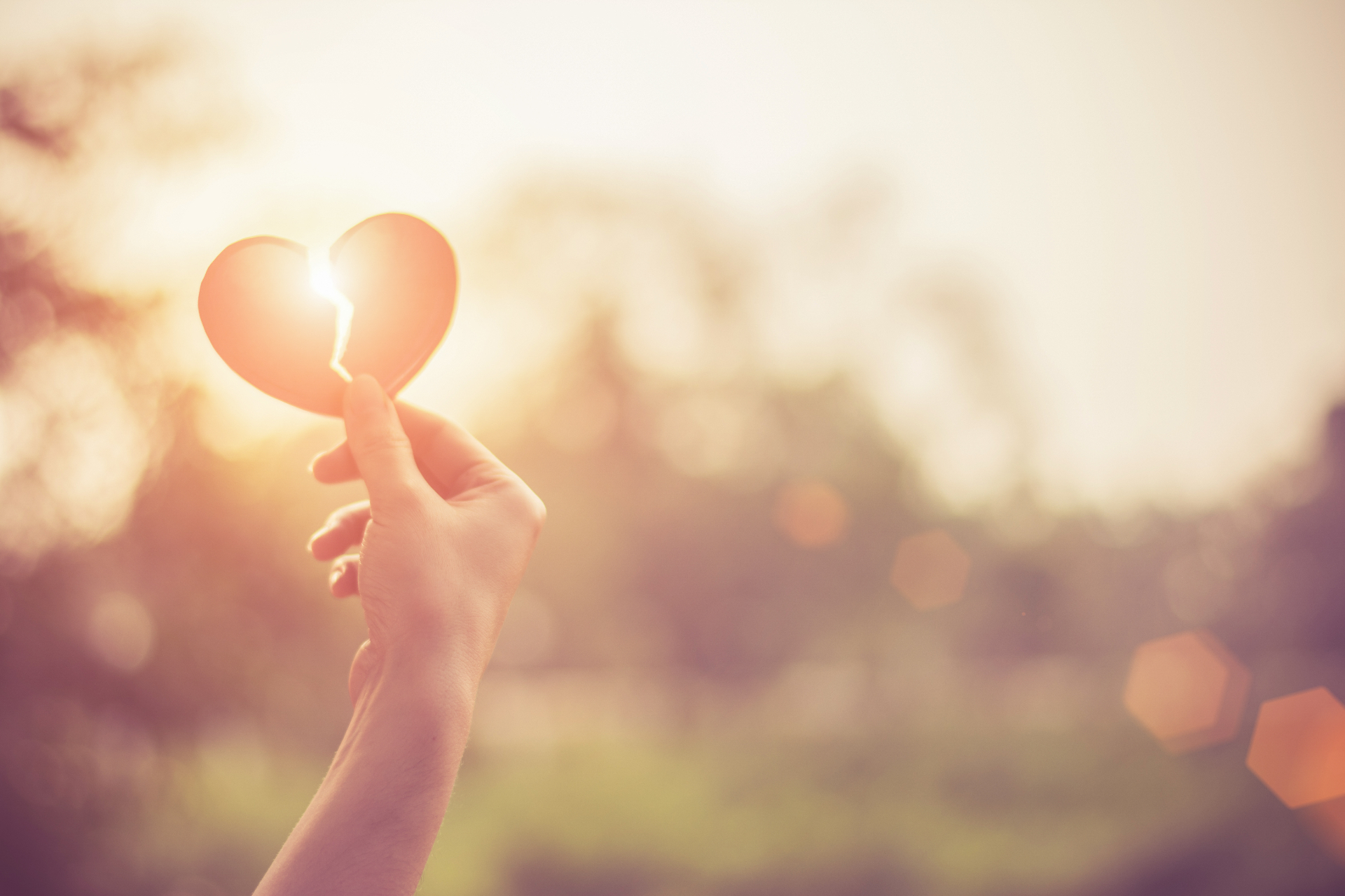 A person holds a paper heart ripped down the middle against the sunlight. Learn how EMDR in Palm Beach, FL area can help you cope with grief and loss. Learn more about EMDR therapy in Delray Beach, FL and other services by contacting an EMDR therapist in Palm Beach, FL today.