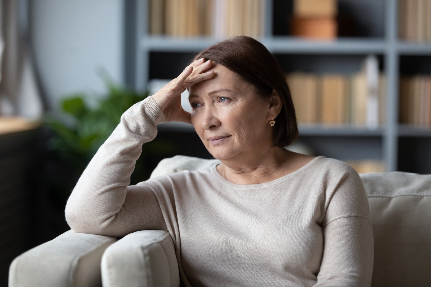A woman sits with a bleak expression with her hand on her forehead. Learn how an addiction therapist in Palm Beach, FL can offer support in addressing different types of addiction in Palm Beach, FL. Searching “addiction therapist Pal Beach” can help you today!