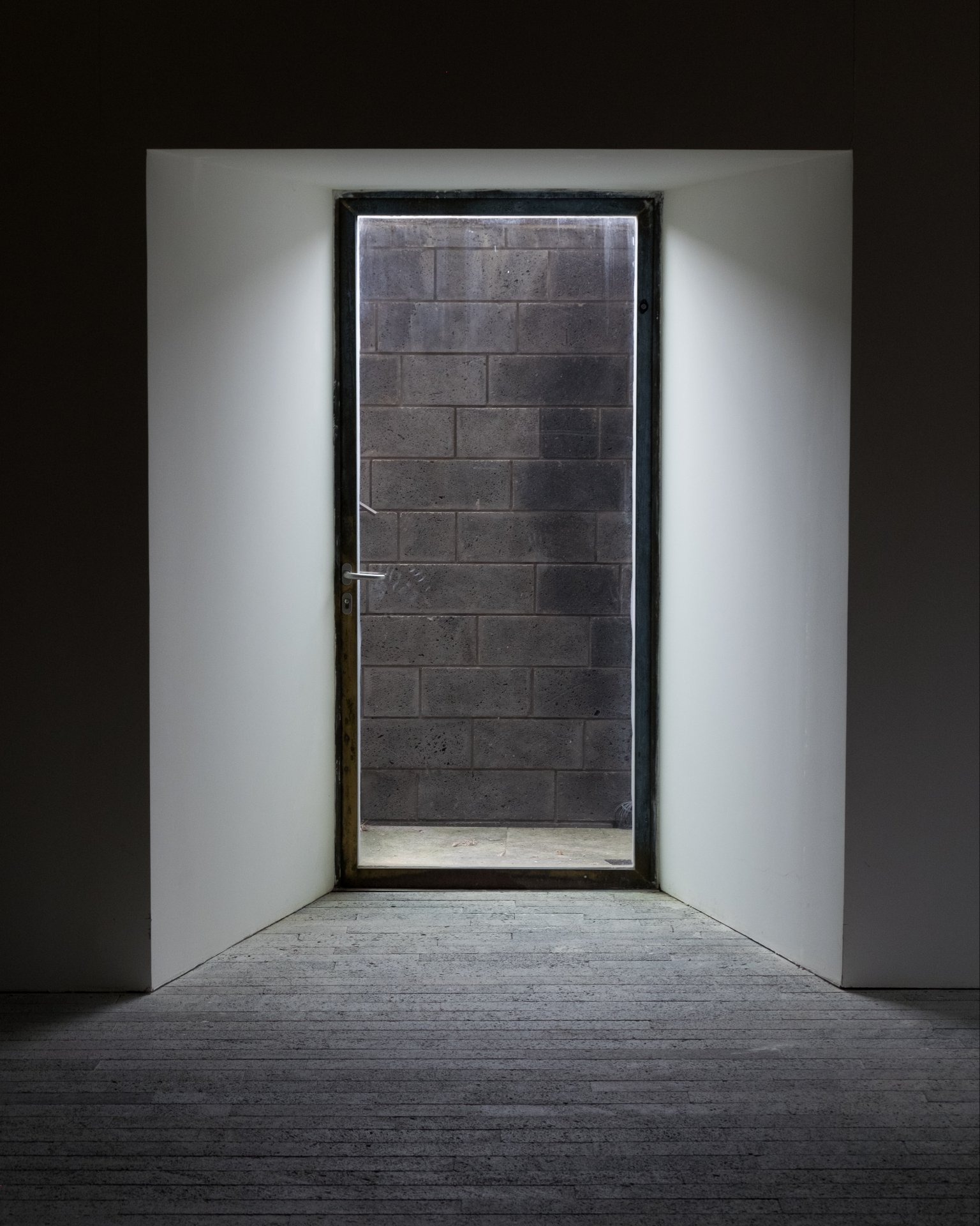 A bleak doorway opens to a brick wall. This could represent emotional repression a therapist in Delray Beach, FL can offer support in overcoming. Learn more about child therapy in Delray Beach, FL, and other services today. 