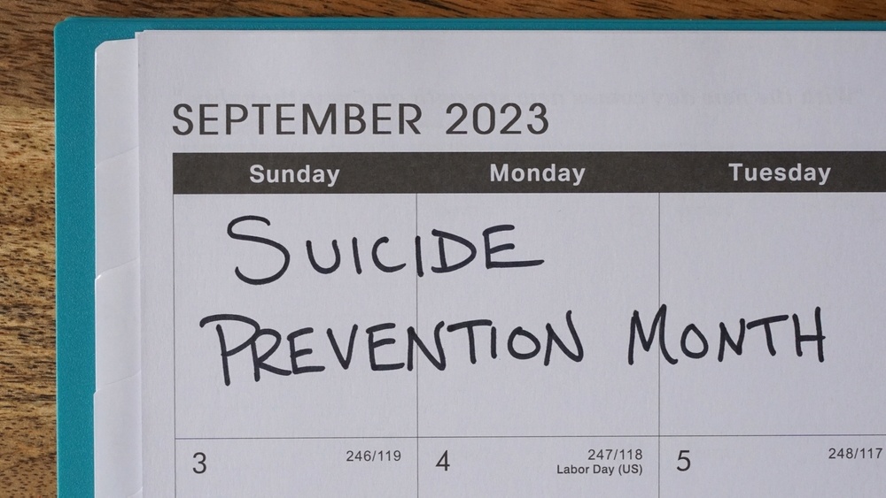 A close up of a calendar on September that reads suicide prevention month. Learn more about the support Delray Beach Therapy can offer support in overcoming depression. Contact a therapist in Delray Beach, FL to learn more about the help Delray Beach depression counseling.