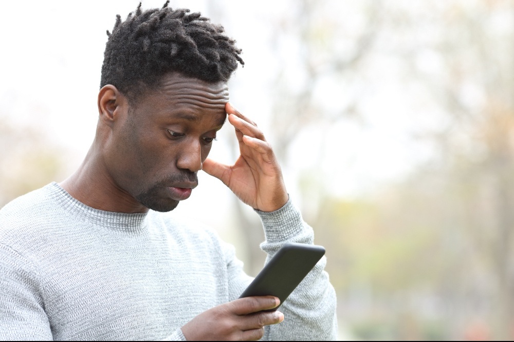 A man appears surprised while looking at their phone. This could represent the surprise of traumatic news that a trauma therapist in Miami, FL can address. Learn more about the help a trauma therapist in Delray Beach, FL can offer by searching for trauma treatment in Palm Beach County, FL. 
