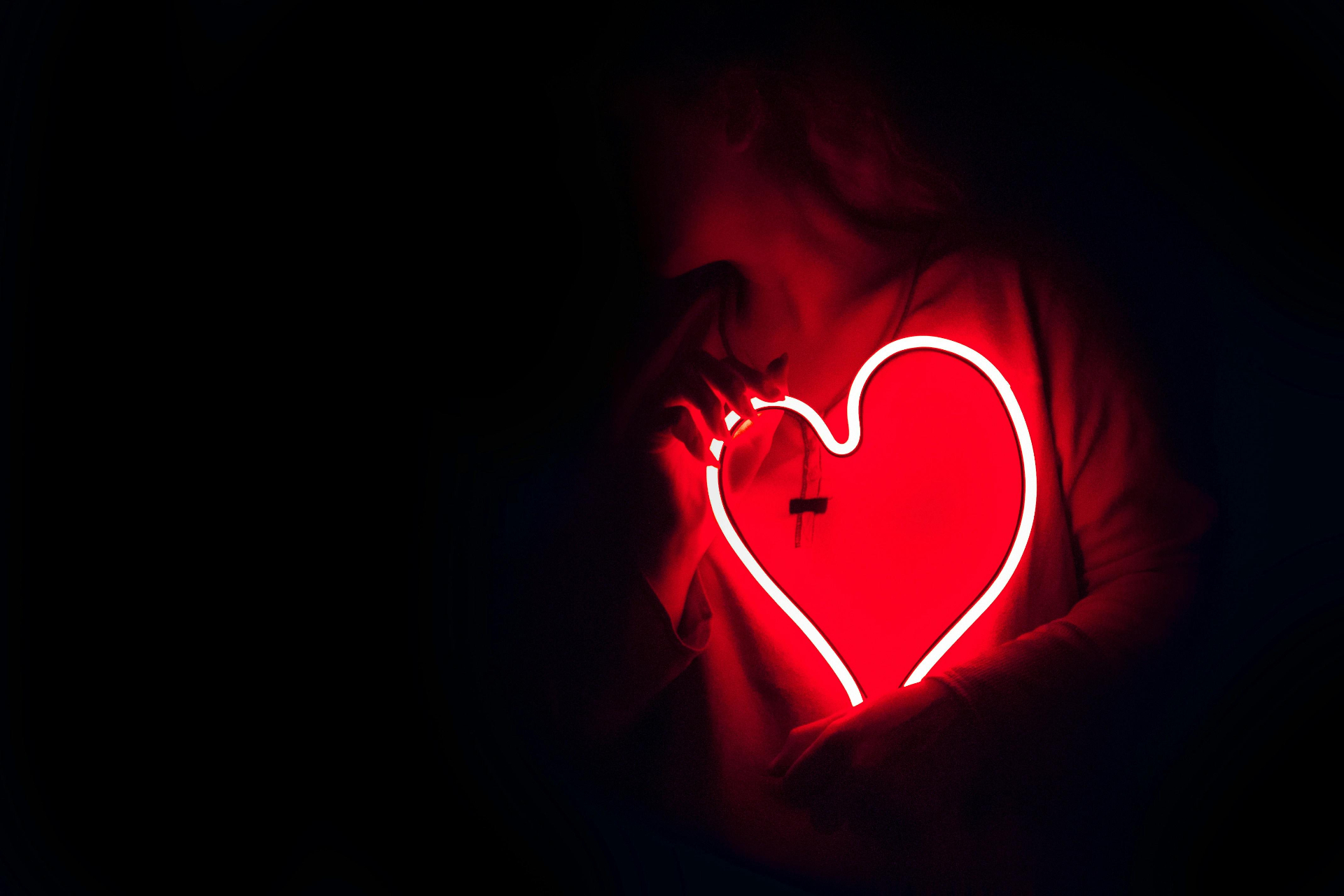 A close up of a person holding a neon light of a heart against their chest. This could represent the overwhelming feelings of love addition. Learn more about an addiction therapist in Palm Beach County, FL. Search for addiction counseling in Palm Beach, FL by contacting an addiction therapist in Palm Beach, FL. They can offer addiction counseling in Delray Beach, FL and more.