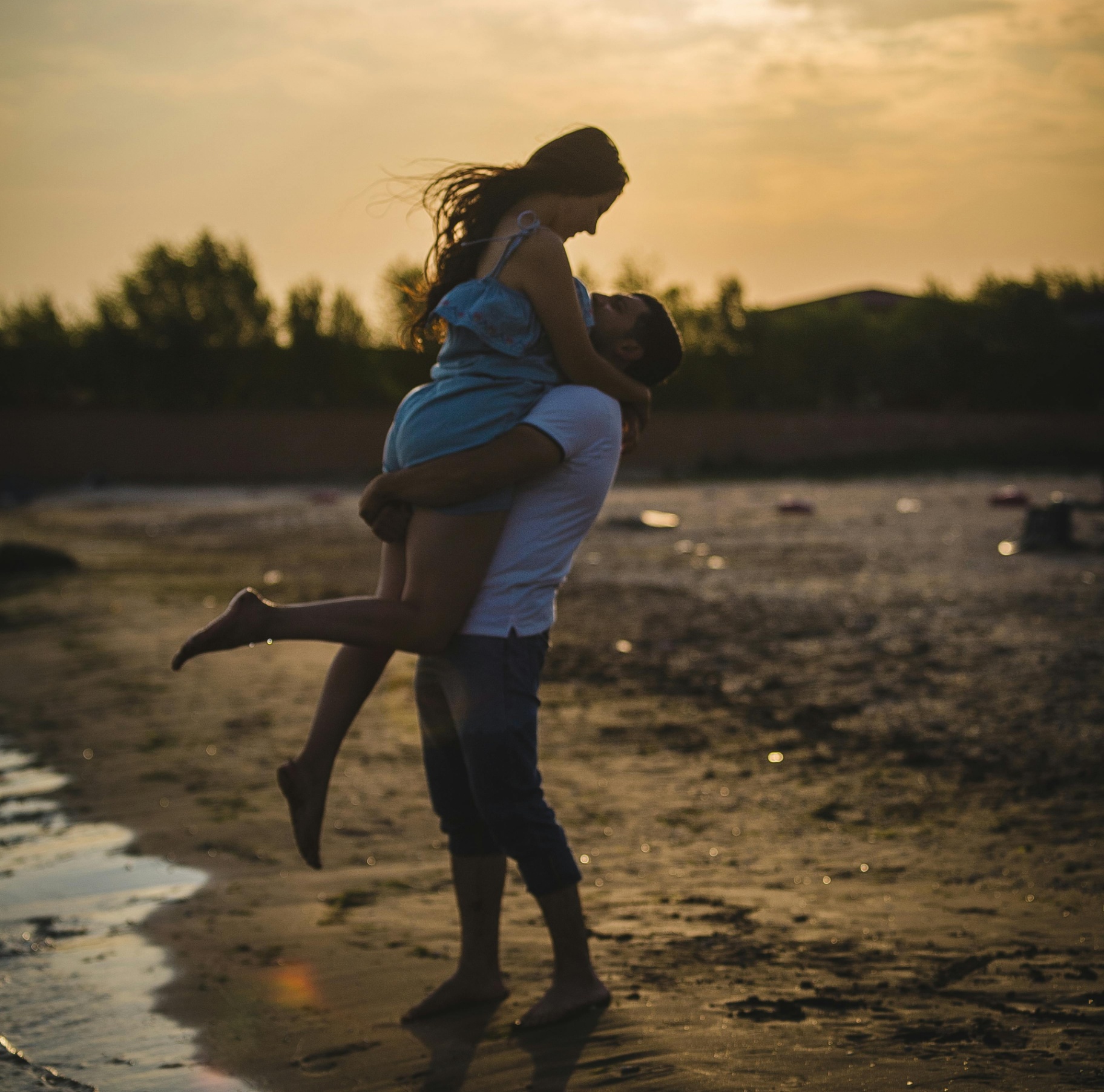 A couple embrace while standing on a shore in the evening sunlight. This could represent falling in love with a partner. Learn how an addiction therapist in Palm Beach County, FL can offer support by searching for addiction counseling in Palm Beach, FL. An addiction therapist in Palm Beach, FL can help today. 