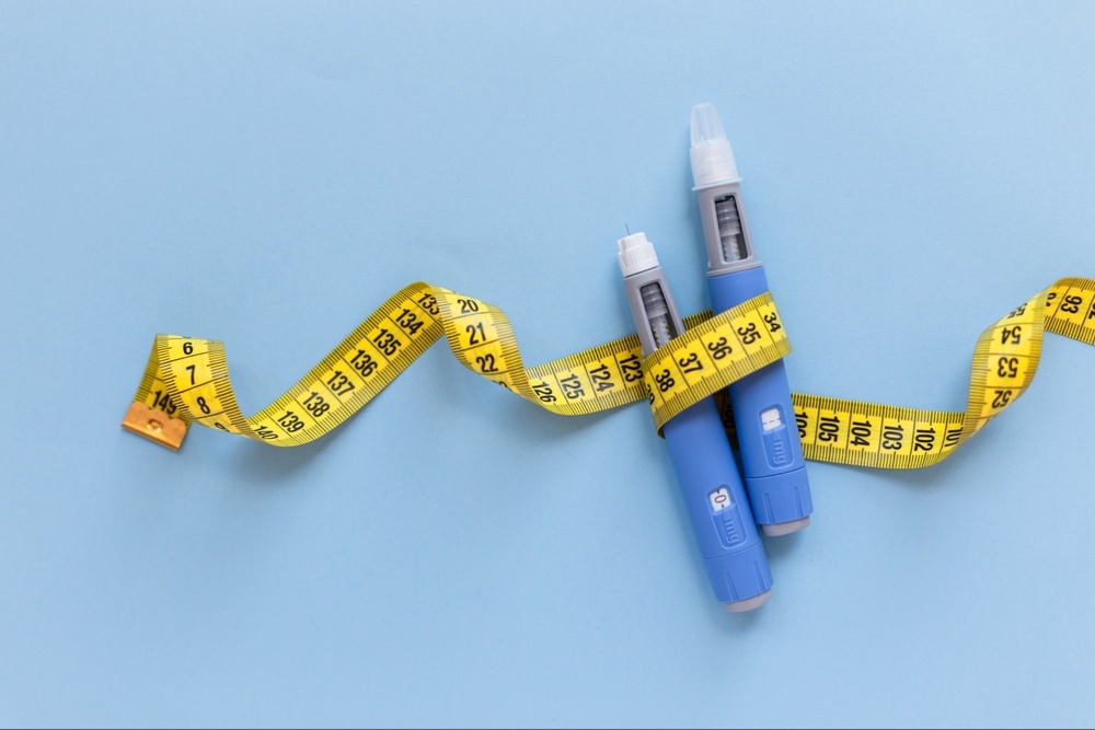 A top down view of a ozempic injection wrapped in measuring tape. Learn how a binge eating therapist in Delray Beach, FL can help you cope with eating disorders along with weight loss drugs. Search for a therapist in Delray Beach, FL and how Palm Beach County, FL therapy can help you today.