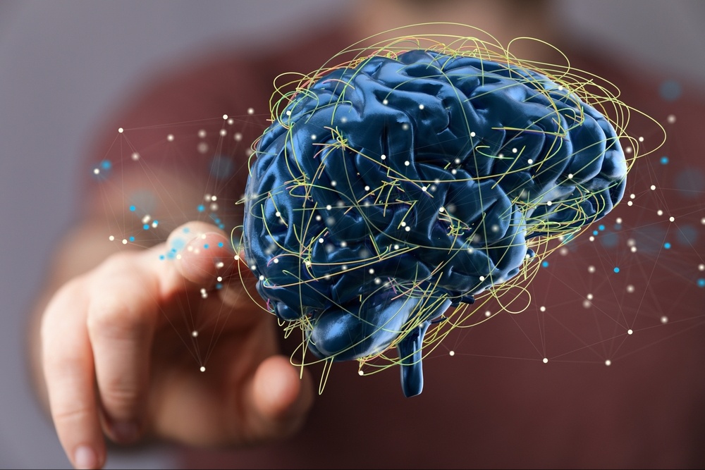 A close up of a 3d brain graphic with a person reaching toward it. This could represent the benefits of brainspotting in Delray Beach, FL. Contact a trauma therapist near t Raton, FL to learn more about the support that trauma treatment in Palm Beach County, FL today. 